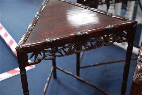 An unusual Chinese rosewood triangular shaped nest of quartetto tables, W.2ft